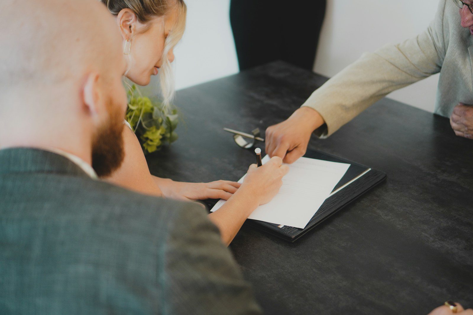 Thailand's ฿3 Million Property Visa Is Suspended. Here's Why I Wouldn't Panic. 4 Couple signing a property purchase contract